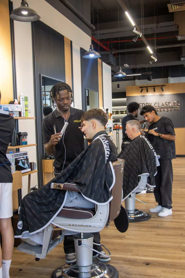 Professional barber giving clean shave in Dubai at Freddy Classics barbershop
